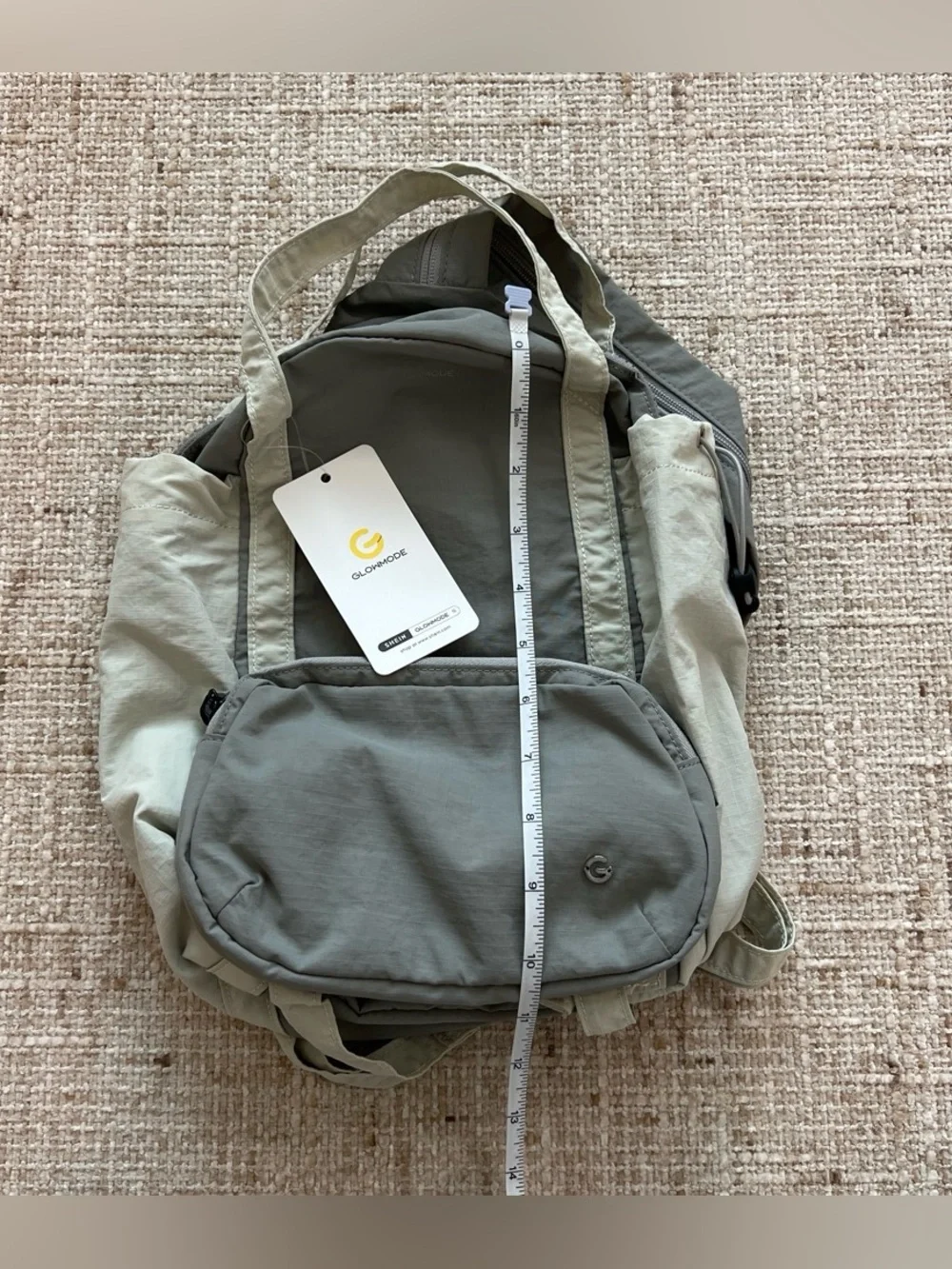 Glowmode gray backpack with detachable pouch and separate zip strap